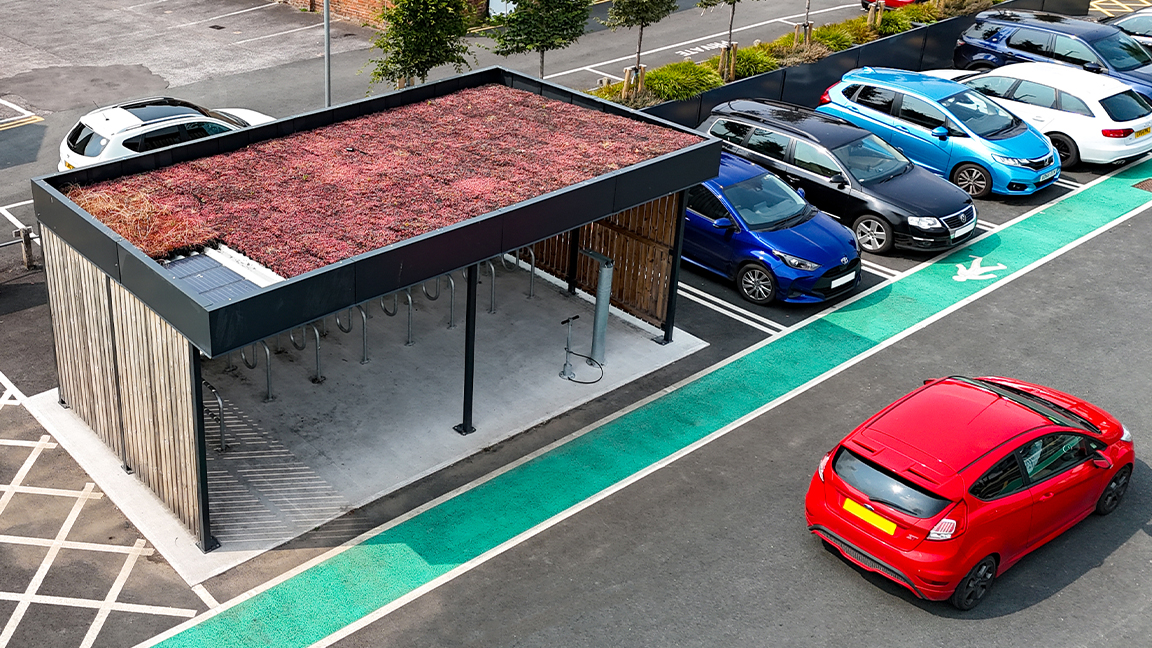 Cycle Hub with green roof and solar lighting - featuring bike parking including cargo bikes - plus repair station and bike pump