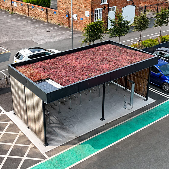 Cycle Hub with green roof and solar lighting - featuring bike parking including cargo bikes - plus repair station and bike pump