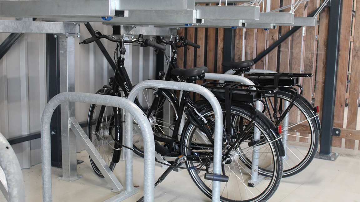 Cycle Hub with green roof - featuring bike parking including cargo bikes - plus repair station and bike pump