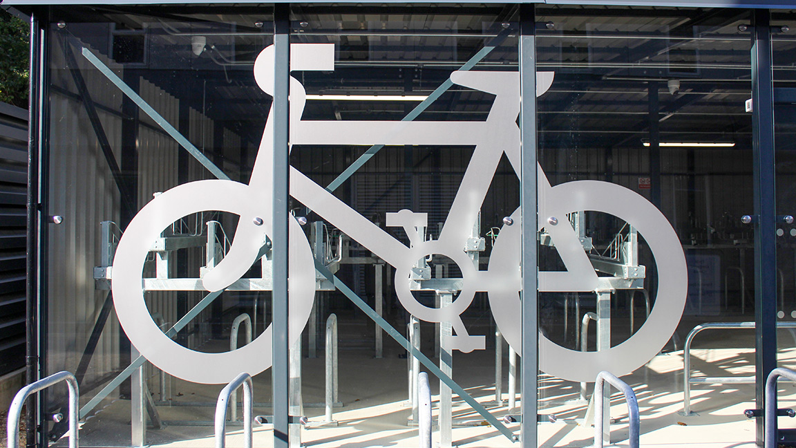 Cycle Hub with green roof - featuring bike parking including cargo bikes - plus repair station and bike pump