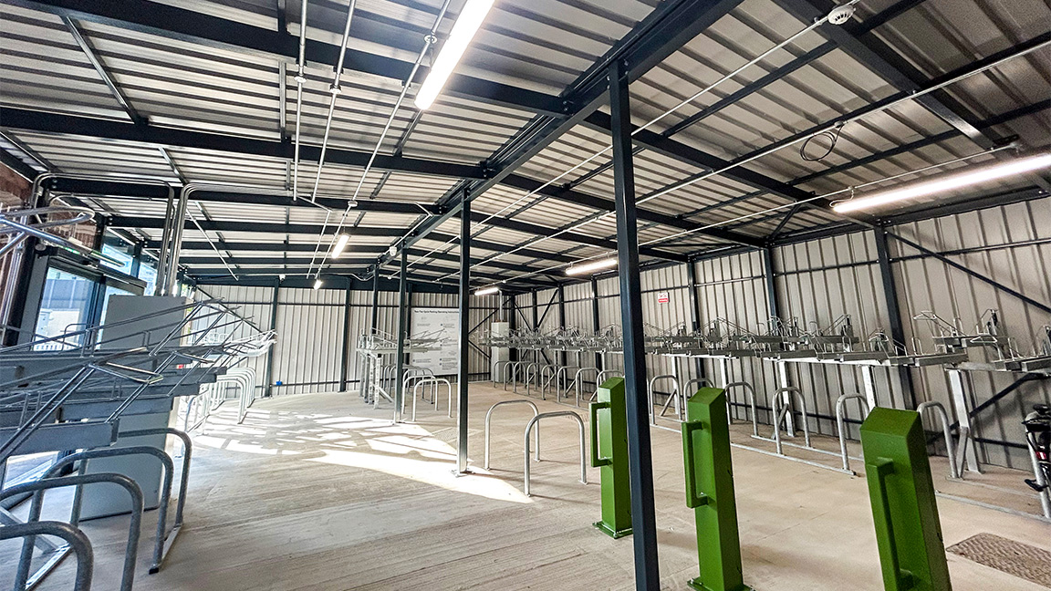 Cycle Hub with green roof - featuring bike parking including cargo bikes - plus repair station and bike pump