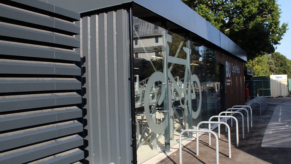 Cycle Hub with green roof - featuring bike parking including cargo bikes - plus repair station and bike pump