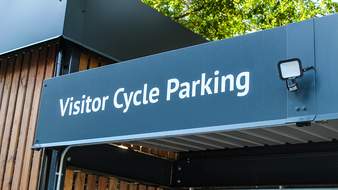 Cycle Hub with green roof - featuring bike parking including cargo bikes - plus repair station and bike pump