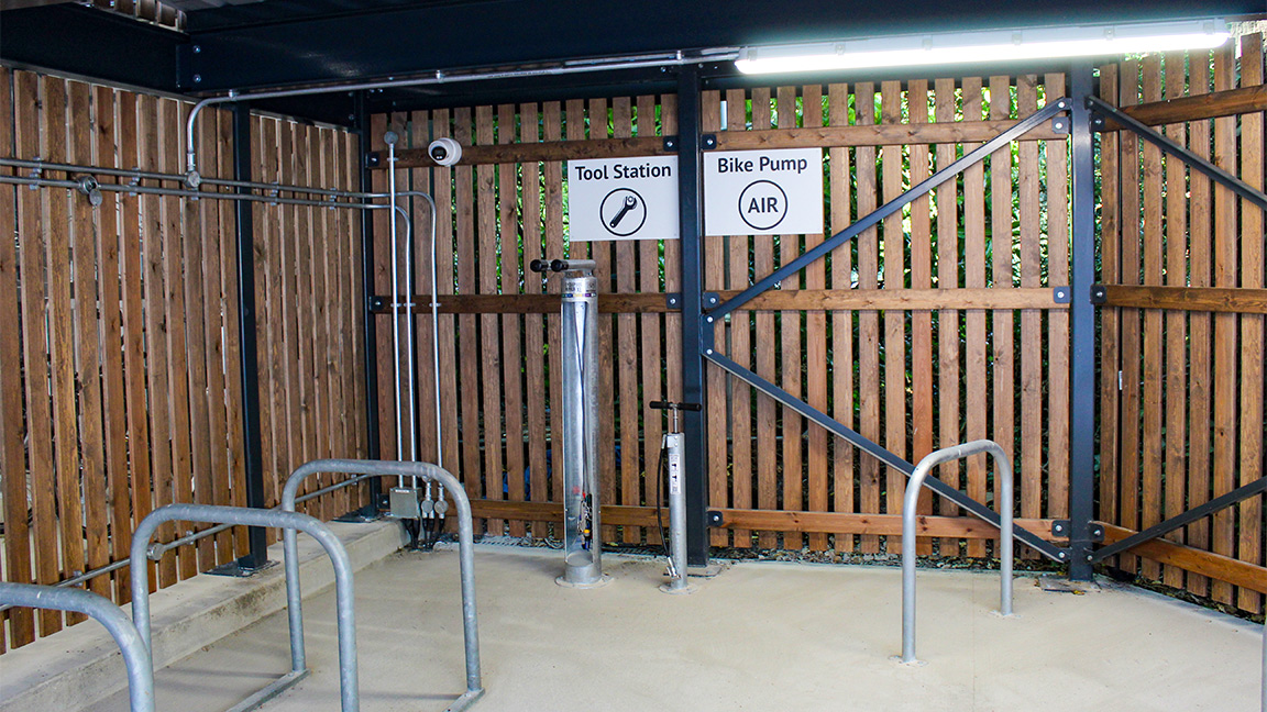 Cycle Hub with green roof - featuring bike parking including cargo bikes - plus repair station and bike pump
